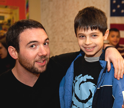 Chapel Hill Academy teacher with young male student